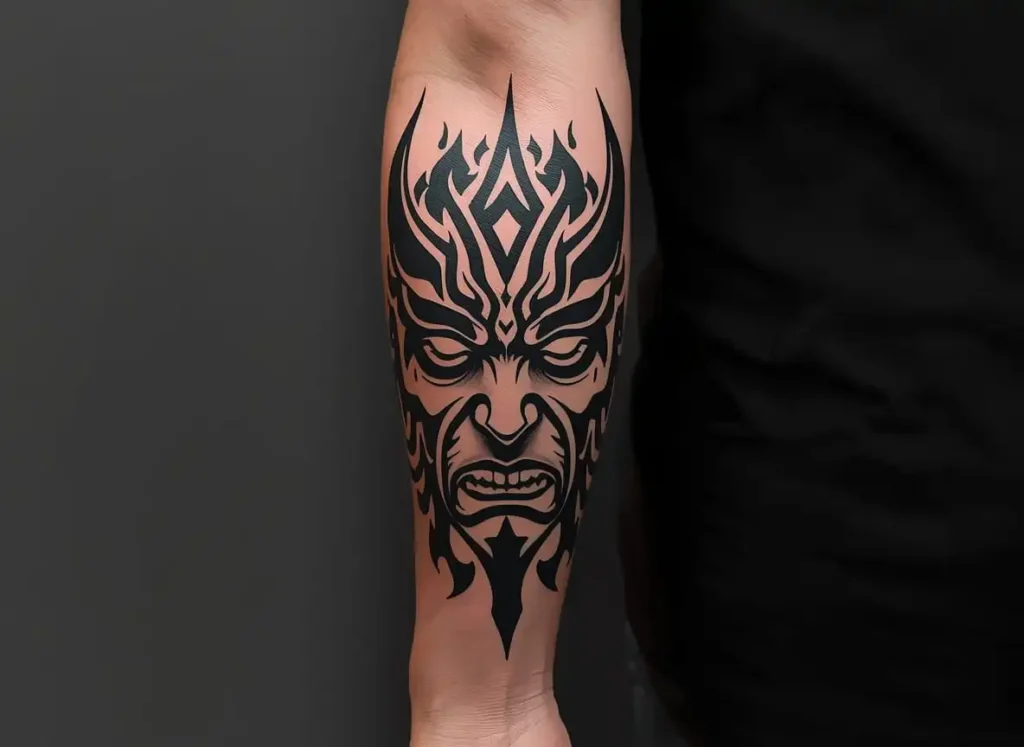 Tribal demon face forearm tattoo men
